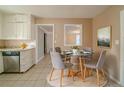 Cozy dining area with a glass table, neutral walls, and a view to the kitchen at 2693 Larkspur Se Dr, Atlanta, GA 30316