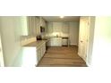 Well-lit kitchen boasts stainless appliances and plentiful cabinet space at 45 Emerald Ln, Covington, GA 30014