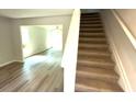 View of the staircase featuring carpeted steps and white railing at 45 Emerald Ln, Covington, GA 30014
