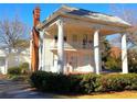 Beautiful two-story home with a brick chimney and impressive white columns at 1242 Star Ne Dr, Brookhaven, GA 30319