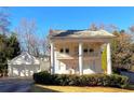Elegant two-story home boasts impressive columns and an attached two-car garage for convenience at 1242 Star Ne Dr, Brookhaven, GA 30319
