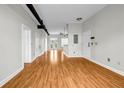 Large living room with hardwood floors, white walls, and open concept design into other rooms at 502 Sw Pryor Sw St # 325, Atlanta, GA 30312