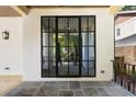 Elegant entrance featuring a black-framed glass door with tiled floor and natural light at 555 Orme Ne Cir, Atlanta, GA 30306