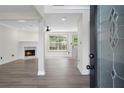 Inviting view through a front door into an open living area with a fireplace at 5399 Emily Cir, Ellenwood, GA 30294