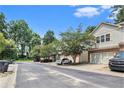 Street view showing the home's curb appeal with mature trees and landscaping at 876 Ivydale Ln # 63, Lawrenceville, GA 30045
