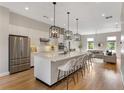 Modern kitchen with stainless steel appliances, a large island, and stylish pendant lighting at 204 Wilbur Se Ave, Atlanta, GA 30316