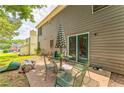 Cozy backyard patio area featuring a table with chairs, and an umbrella for outdoor relaxation at 4945 Penscot Way, Stone Mountain, GA 30088