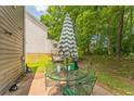 Outdoor patio featuring a table with chairs, great for entertaining and relaxing in the backyard at 4945 Penscot Way, Stone Mountain, GA 30088