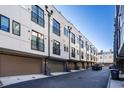 Row of townhouses featuring attached garages and modern architectural details at 77 Krog Ne St, Atlanta, GA 30307