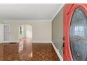 Living room featuring parquet flooring and an arched doorway at 1098 Cascade Sw Cir, Atlanta, GA 30311
