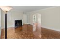Bright living room showcasing parquet floors, fireplace, and abundant natural light at 1098 Cascade Sw Cir, Atlanta, GA 30311