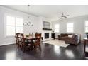 Open living space with a dining area, fireplace and comfortable seating, great for entertaining at 2026 Forte Lane, Alpharetta, GA 30009