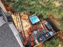 Aerial view of a backyard oasis with hot tub, lounge chairs, and outdoor dining area at 2620 Middle Coray Cir, Marietta, GA 30066