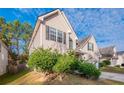 Angle view displaying lush lawn, trees, and the home's exterior at 2931 Two Lake Cir, Atlanta, GA 30349