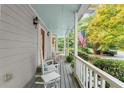 Cozy porch with rocking chairs, views of the neighborhood, and a patriotic American flag at 2789 Brookcliff Lndg, Marietta, GA 30062