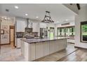 Spacious kitchen features a large center island, stainless steel appliances and stylish countertop at 48 Old Canton Ne Rd, Cartersville, GA 30121