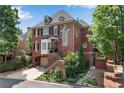 Inviting two-story brick home with a well-maintained landscape and walkway at 1029 Fairway Ne Ests, Atlanta, GA 30319