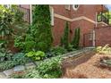 Close up of landscaped pathway with rocks, mulch and various shrubbery around perimeter at 1029 Fairway Ne Ests, Atlanta, GA 30319