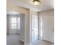 Inviting entryway with neutral colors, tiled floors, and ample natural light at 625 Compton Ln, Mcdonough, GA 30253