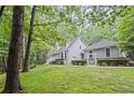 Beautiful home nestled in a lush, green landscape offering a sense of privacy and tranquility at 115 Leaf Lake Dr, Suwanee, GA 30024