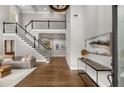 Stunning foyer with hardwood floors, staircase, two-story ceiling, and modern decor at 3699 Canyon Ridge Ne Ct, Brookhaven, GA 30319