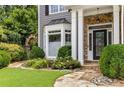 Close up view of the stone pathway leading to front door, surrounded by lush greenery at 3699 Canyon Ridge Ne Ct, Brookhaven, GA 30319