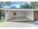 Open carport area offering shelter for vehicles and access to the home's exterior at 6243 David Sw Ln, Mableton, GA 30126