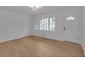 Charming living room features sleek floors, natural light, and front door entrance at 6243 David Sw Ln, Mableton, GA 30126