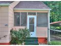 Charming screened front porch with brick accents and a cozy feel at 304 Warren Se St, Atlanta, GA 30317