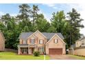 Beautiful brick home with a well-maintained lawn, features a classic design and inviting curb appeal at 1110 Cureton Dr, Austell, GA 30106
