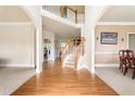 Spacious foyer with hardwood flooring and a staircase leading to a second-floor landing at 1110 Cureton Dr, Austell, GA 30106