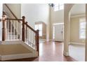 Open foyer with hardwood floors, natural light, with stairs to a second floor at 1110 Cureton Dr, Austell, GA 30106