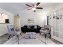 Bright living room with a ceiling fan and elegant French doors and hardwood floors at 215 Summit North Ne Dr, Atlanta, GA 30324