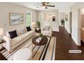 Bright, staged living room featuring hardwood floors, neutral colors, and lots of natural light at 690 Horsley Mill Rd, Carrollton, GA 30116