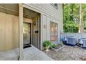 Stylish front entrance features a modern glass door and attractive landscaping at 882 Cedar Canyon Se Sq, Marietta, GA 30067