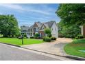 Charming home featuring lush landscaping, a long driveway, and mature trees at 1409 Echo Mill Dr, Powder Springs, GA 30127