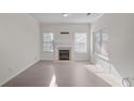 Inviting living room with fireplace and large windows providing natural light at 2594 Laurel Nw Cir, Atlanta, GA 30311