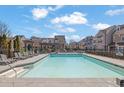 Relaxing community pool surrounded by lounge chairs, perfect for summer days at 3005 Devoncroft Se St, Smyrna, GA 30080