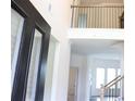 Bright foyer with soaring ceilings, decorative railing, and natural light at 150 Canal St, Hampton, GA 30228