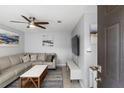 Cozy living room featuring a comfortable sectional sofa and modern ceiling fan at 1500 Pine Log #D Ne Rd, Conyers, GA 30012