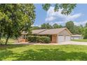 Lovely brick home with an attached two-car garage and screened porch in a beautiful neighborhood at 7928 S Giles Rd, Douglasville, GA 30135