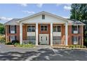 Inviting exterior with columns, brick facade, and well-maintained landscaping at 135 E Hill St # 22, Decatur, GA 30030
