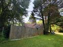 View of the home's backyard surrounded by lush trees, creating a peaceful, private outdoor space at 4298 Hillview Dr, Acworth, GA 30101