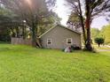 Rear view of home featuring a spacious yard; the perfect canvas for outdoor living and entertaining at 4298 Hillview Dr, Acworth, GA 30101
