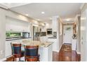 Modern kitchen with an island, stainless steel appliances, and bright white cabinets, offering a sleek design at 890 Lake Dr, Snellville, GA 30039