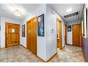 Inviting foyer with tile flooring, chandelier, and multiple closets for ample storage at 1138 Berkeley Rd, Avondale Estates, GA 30002