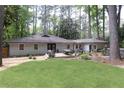 Spacious backyard with a large deck, perfect for outdoor entertaining and relaxation at 1443 Fama Ne Dr, Atlanta, GA 30329