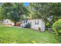 Charming home with a well-manicured lawn, mature trees and shrubs providing privacy at 1636 Mary George Nw Ave, Atlanta, GA 30318