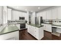 Charming kitchen with stainless steel appliances, an island, and white cabinets at 2342 Tall Timbers Ln, Marietta, GA 30066