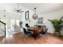 Stylish dining area with elegant lighting, seamlessly connected to the living space at 303 Roswell Green Ln, Roswell, GA 30075